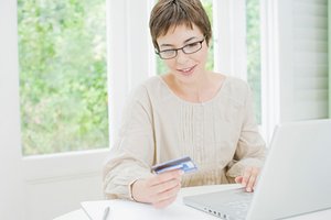 Paying off credit card balance via computer