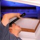 Man conducting his own home energy audit